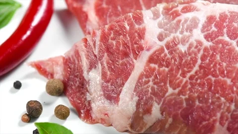 Raw meat isolated on white background. Prime fillet meat. Marble beef steak  Stock Footage 307230621