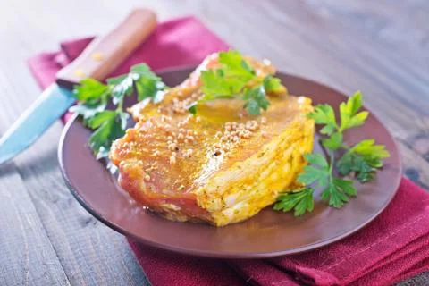Raw meat with marinade Stock Photos