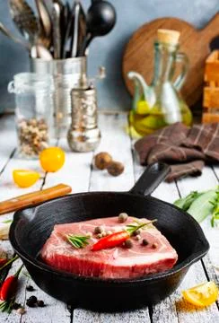 Raw meat in pan Stock Photos