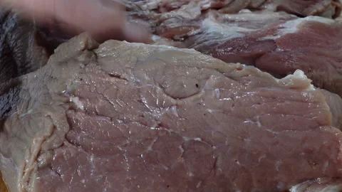 Raw meat pierced with a knife. Close-up Stock Footage 130489981