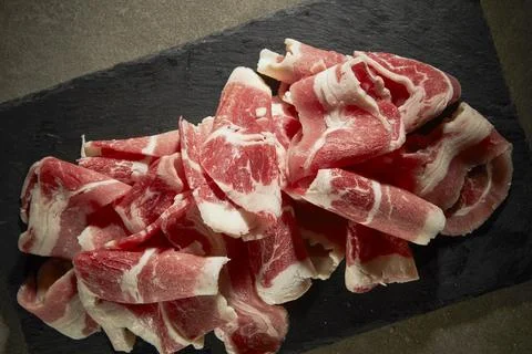 Raw meat on a plate Stock Photos