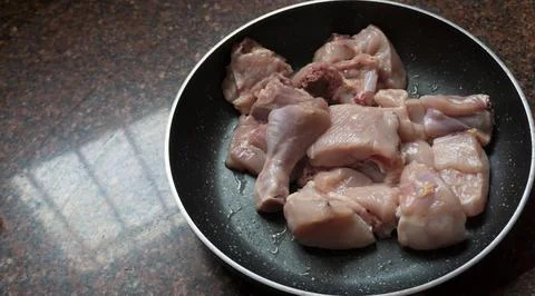 Raw meat ready to be cooked kept in pan 写真素材