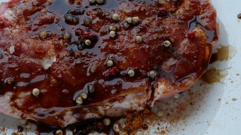 Raw meat is ready to grill-sprinkled with red pepper, salt, white pepper Stock Footage 98194516