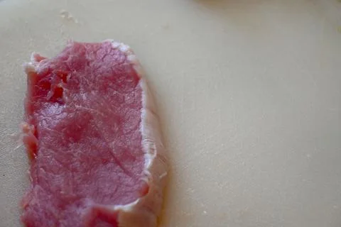 Raw meat slice on a cutting board Stock Photos