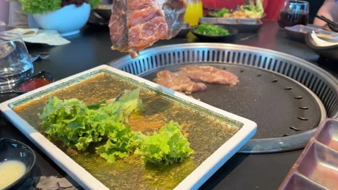 Raw meat slices and chicken, beef and squid pieces cooking tabletop built i.. Stock Footage 335392077
