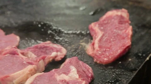 Raw Meat Slices Grilling on Hot Plate at Sydney Market Food Stall, Australia Stock Footage 345803608