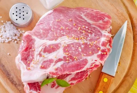 Raw meat with spice Stock Photos