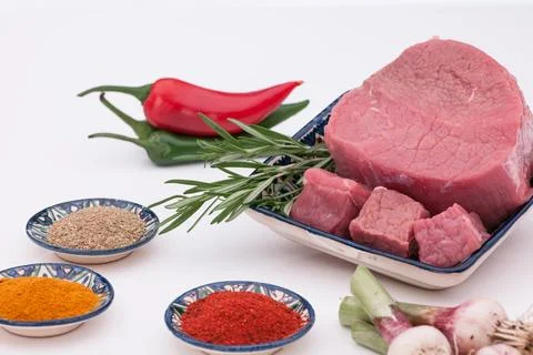 Raw meat with spices Stock Photos