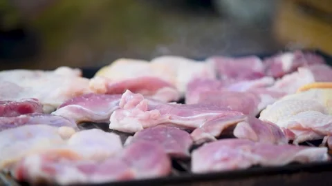 Raw meat still red on barbeque close up Stock Footage 331535741