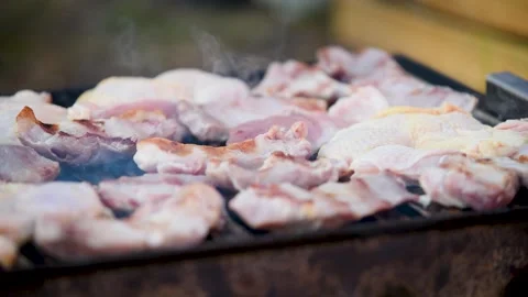 Raw meat still red on barbeque close up Stock Footage 331536496