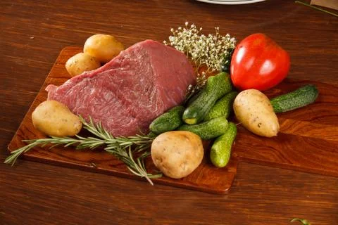 Raw meat with vegetables Stock Photos