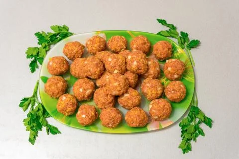 Raw meatballs on a platter Stock Photos