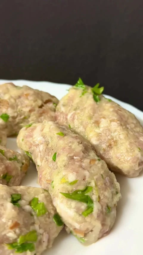 Raw minced meat rolls with chopped fresh green parsley Stock Footage 331974309