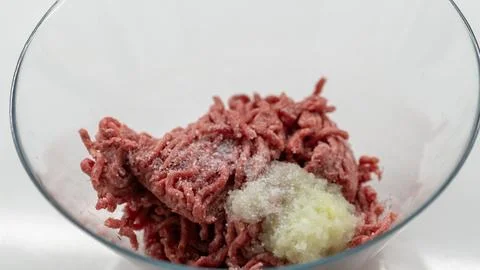 Raw Minced Meat with Salt and Grated Onion in Glass Bowl 写真素材