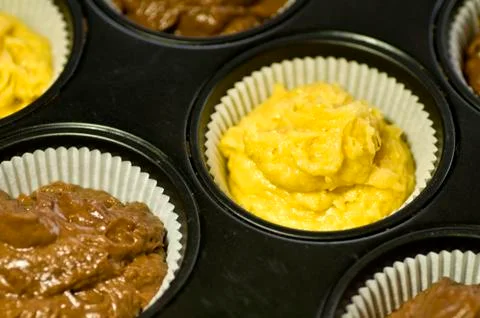 Raw muffins in a tray Stock Photos