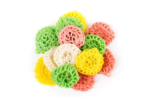 Raw multicolored tapioca crackers in a pile top down isolated over white Stock Photos