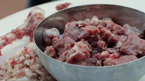 Raw mutton in metall bowl close-up. Muttons meat for uzbek pilaf. Turkey food Stock Footage 256857591