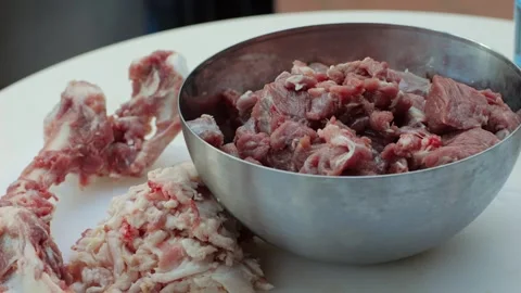 Raw mutton in metall bowl close-up. Muttons meat for uzbek pilaf. Turkey food Stock Footage 257508913