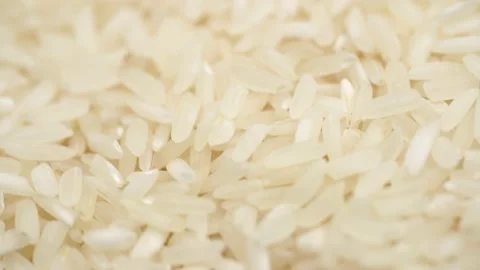 Raw oblong white rice rotates. Stock Footage 234992902
