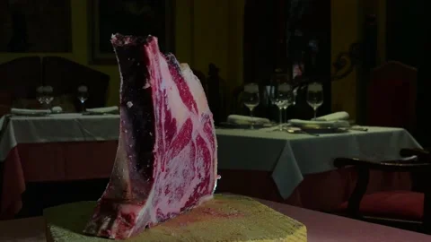 Raw old beef ribeye turning for presentation Stock Footage 137399039