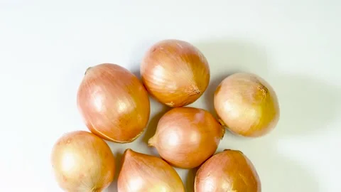 Raw onions group isolated Stock Footage 220761306