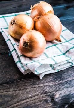 Raw onions on a table Stock Photos