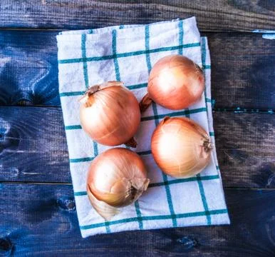 Raw onions on a table Stock Photos