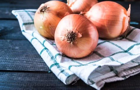 Raw onions on a table Stock Photos