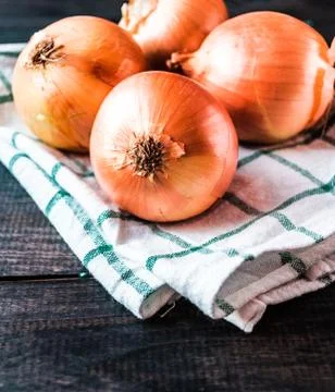 Raw onions on a table Stock Photos