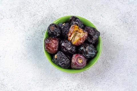 Raw Organic Arabic Dates, Ajwa Dates on light gray background. Ramadan Kare.. Stock Photos
