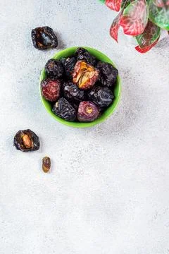 Raw Organic Arabic Dates, Ajwa Dates on light gray background. Ramadan Kare.. Stock Photos