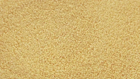 Raw organic couscous grains fall and crumble. Stock-Footage 139355047
