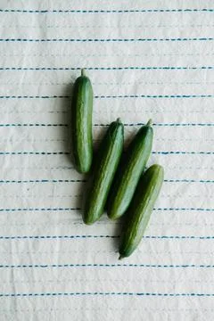Raw organic mini cocktail green cucumbers Stock Photos