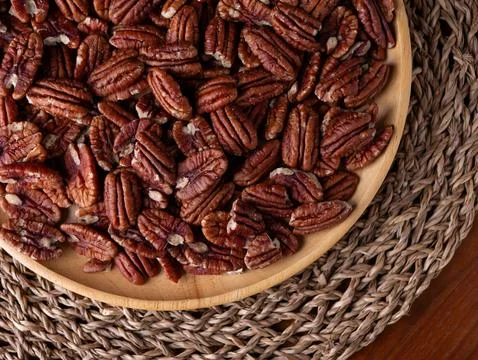 Raw organic pecan nuts pattern background. Stock Photos