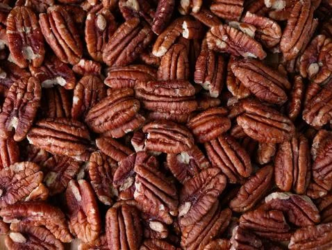 Raw organic pecan nuts pattern background. Stock Photos