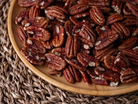 Raw organic pecan nuts pattern background. Stock Photos