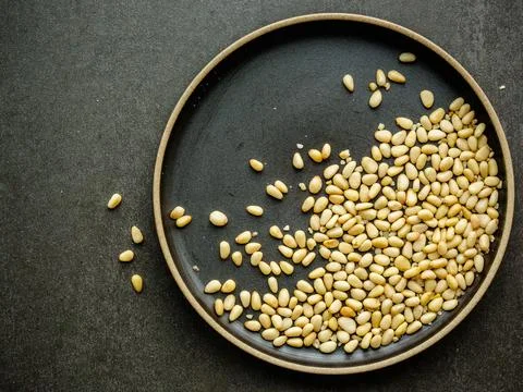 Raw organic pine nuts. Stock Photos