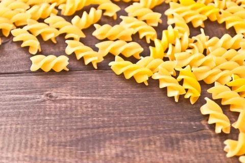 Raw pasta as a background Stock Photos