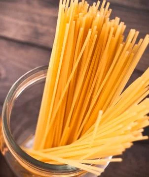 Raw pasta as a background Stock Photos