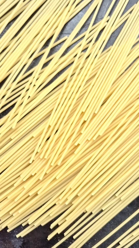 Raw pasta close-up in motion Stock Footage 304677165