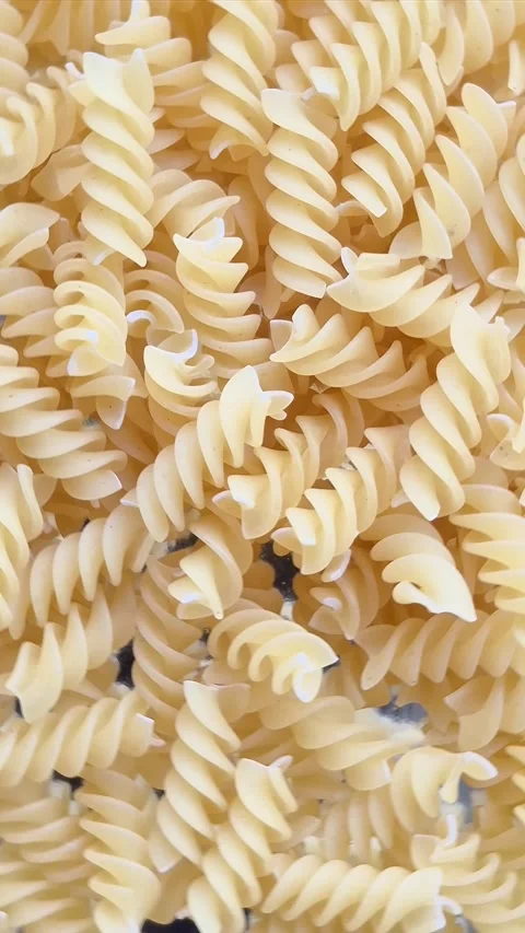 Raw pasta close-up in motion Stock Footage 304677327