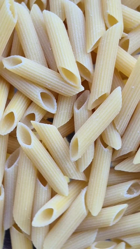 Raw pasta close-up in motion Stock Footage 304677600