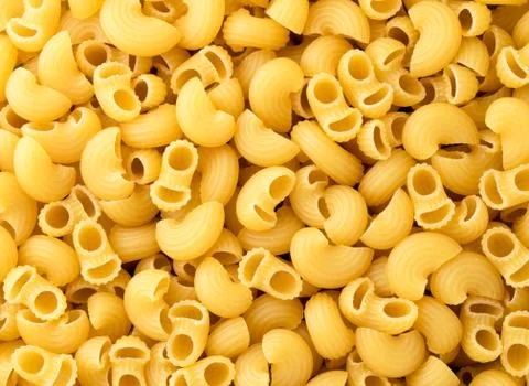 Raw pasta closeup, background. The view of top. Stock Photos