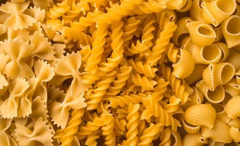 Raw pasta of different types close-up, top View. Foto stock