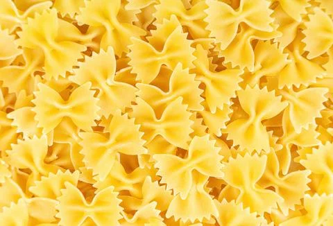 Raw pasta farfalle spaghetti pattern. Food background, italian cuisine Stock Photos