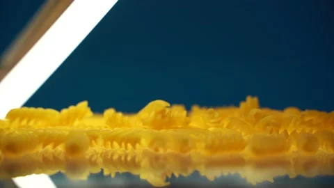 Raw pasta on glass table Stock Footage 133563433