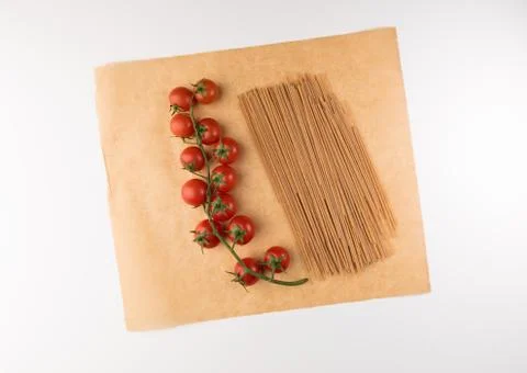 Raw pasta with ingredients for cooking isolated on white background, top view Stock Photos