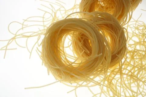 Raw pasta nests Stock Photos