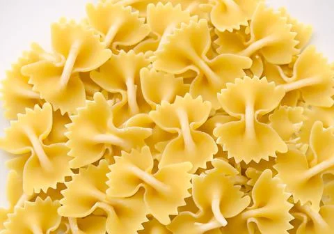 Raw pasta shapes and forms background.. Stock Photos