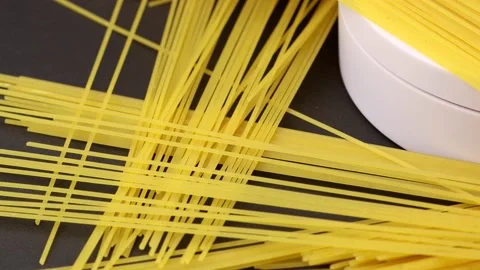 Raw pasta spaghetti 4k isolated on black background rotating Stock Footage 144789129